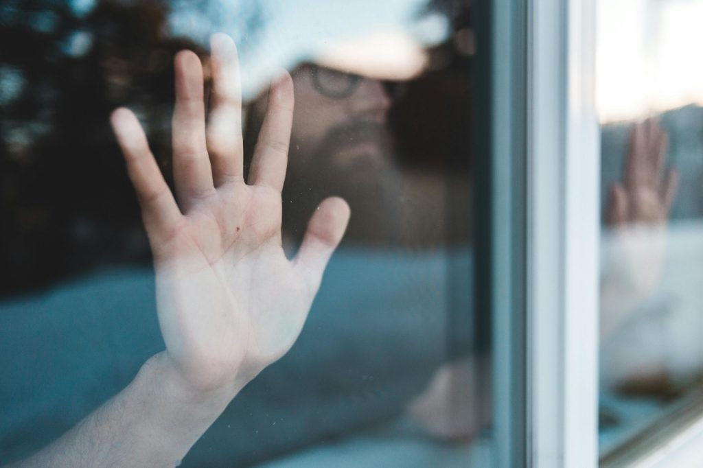 a-person-looking-through-a-window-—-but-viewed-from-the-OPPOSITE-side-of-the-window