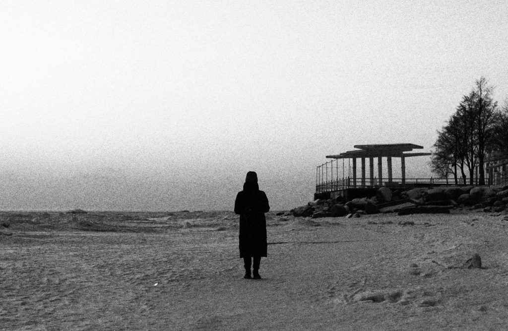 A-lone-figure-seen-from-behind-facing-an-open-horizon