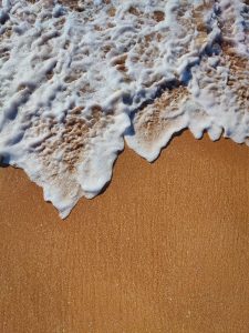 A-wave-receding-over-wet-sand