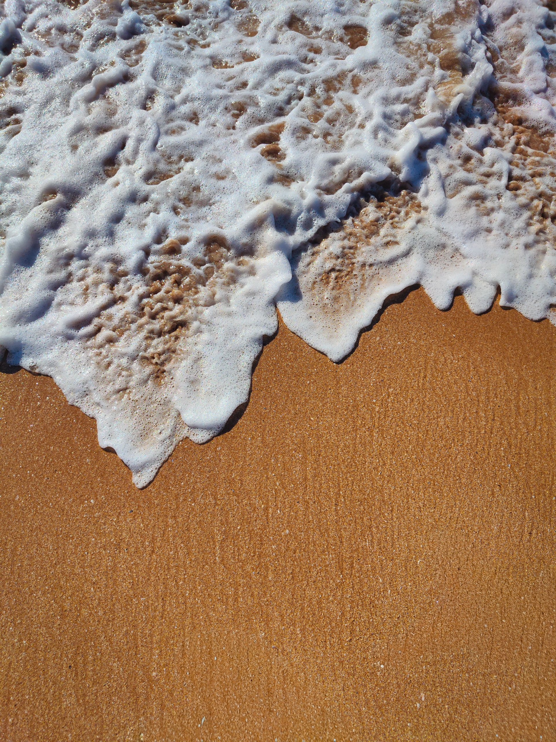 A-wave-receding-over-wet-sand