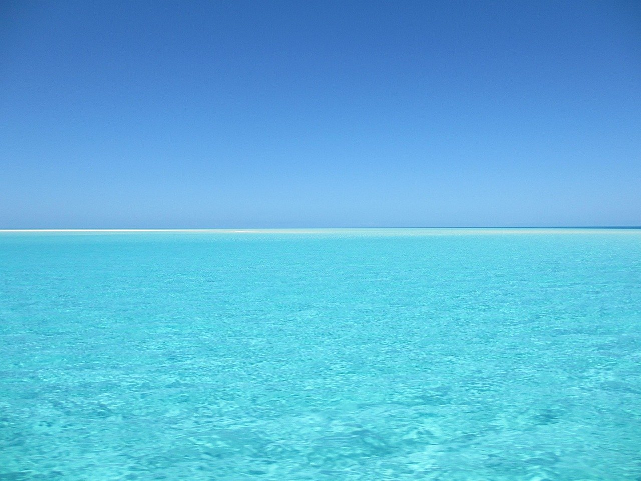 Still-water-reflecting-an-open-sky