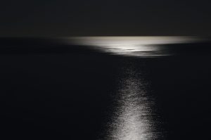 still-dark-surface-of-water-reflecting-night-sky