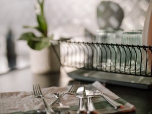 A-stack-of-washed-dishes-drying-on-a-rack