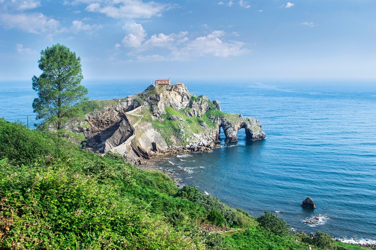 Coastal-cliff-with-visible-rock-strata-massive-unbroken-bottom-layer-no-people