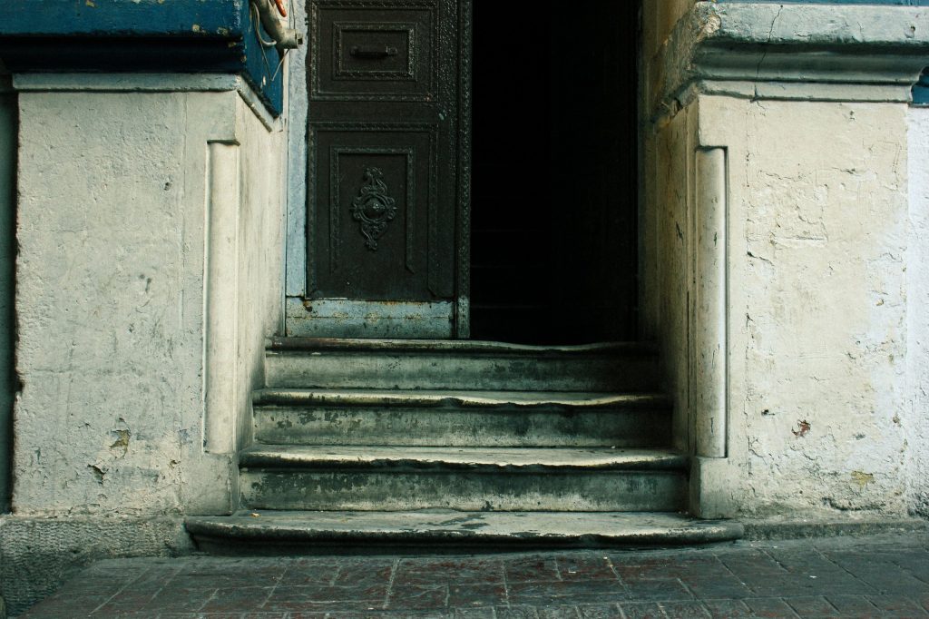 worn-stone-threshold-of-an-old-house-hollowed-by-decades-of-footsteps