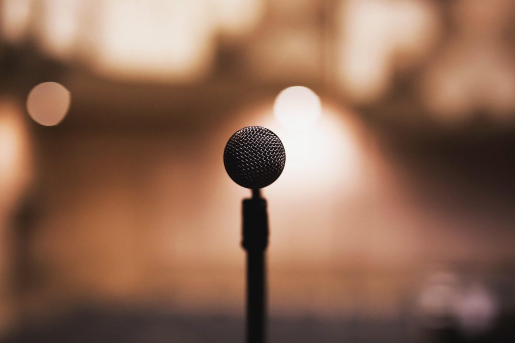 old-microphone-standing-alone-on-an-empty-stage