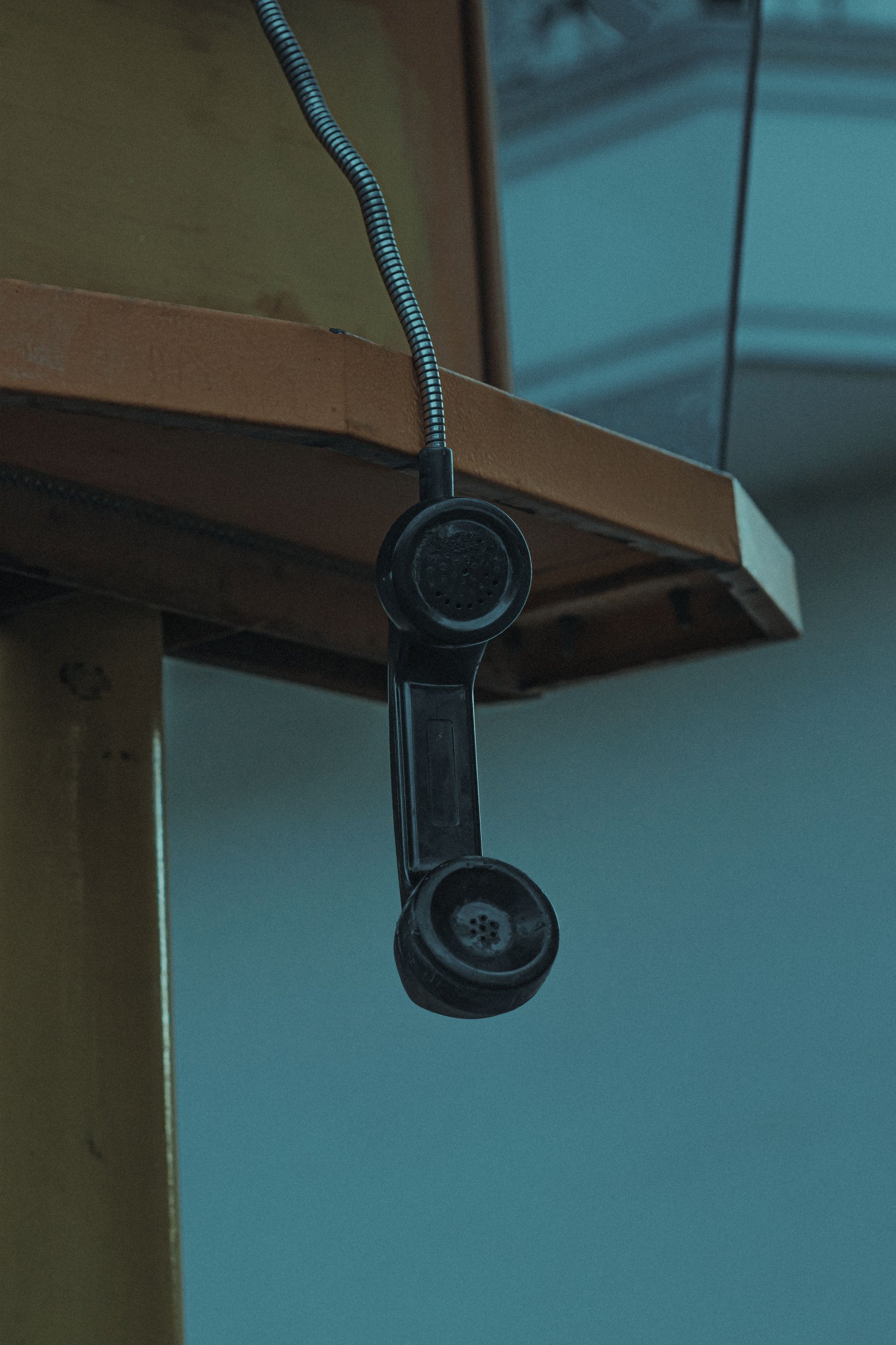 old-telephone-receiver-left-off-its-cradle-on-a-table