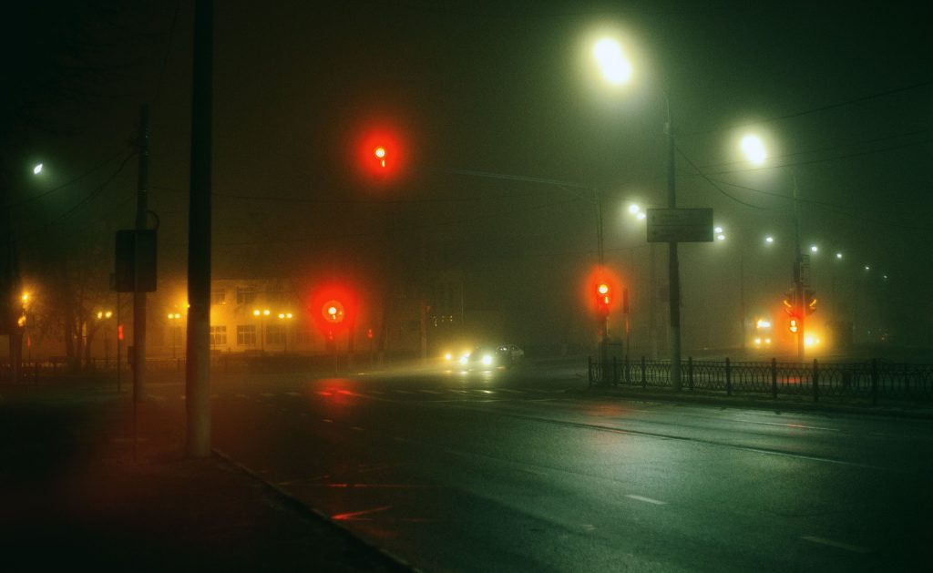 red-traffic-light-glowing-over-an-empty-street